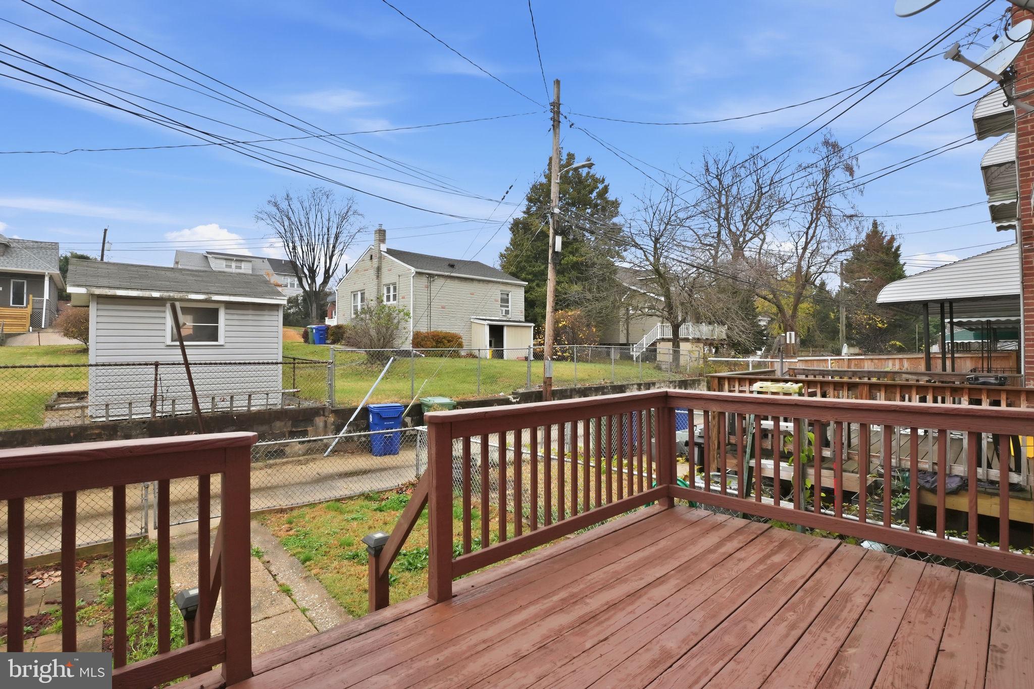 4306 Newport Avenue Baltimore, MD 21211 - Photo 34 of 44 a view of a deck with wooden floor and barbeque oven