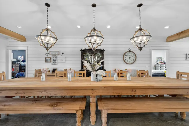 a bed room with a bed and a flat tv screen