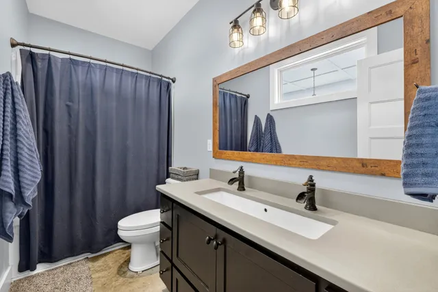 a kitchen with stainless steel appliances granite countertop a stove and cabinets