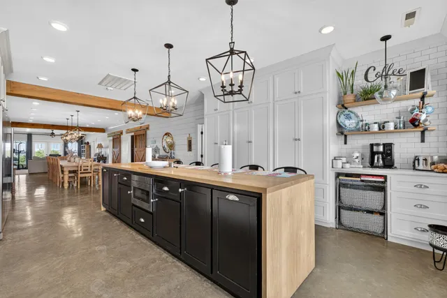 a bathroom with a double vanity sink mirror and toilet
