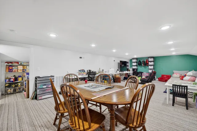 a view of swimming pool with outdoor seating and city view