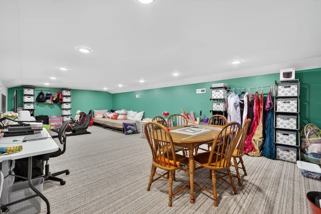 a living room with furniture and flat screen tv