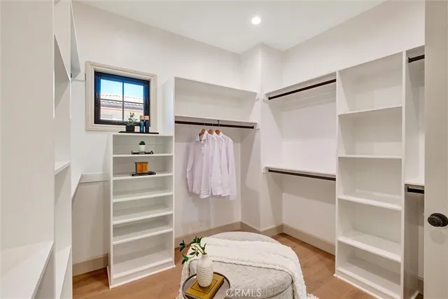 a bathroom with a double vanity sink mirror and bathtub