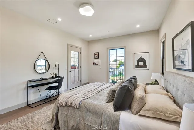 a bedroom with a bed and a table