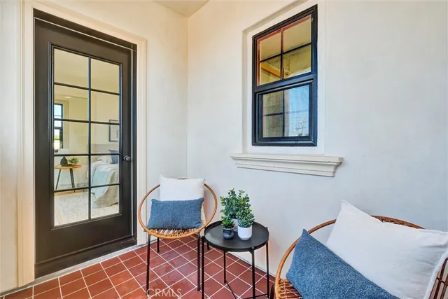 a view of a hallway with wooden floor and closet