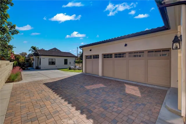a house with swimming pool in front of it