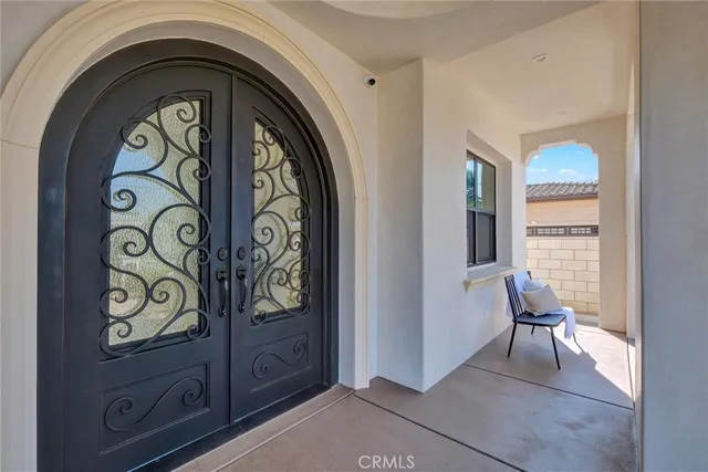 a view of front door with washer and dryer