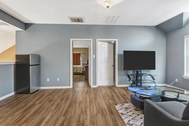 a living room with a couch and a flat screen tv
