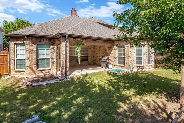 a front view of a house with a garden and porch