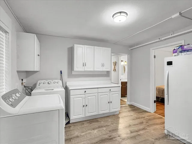 a view of utility room with washer and dryer