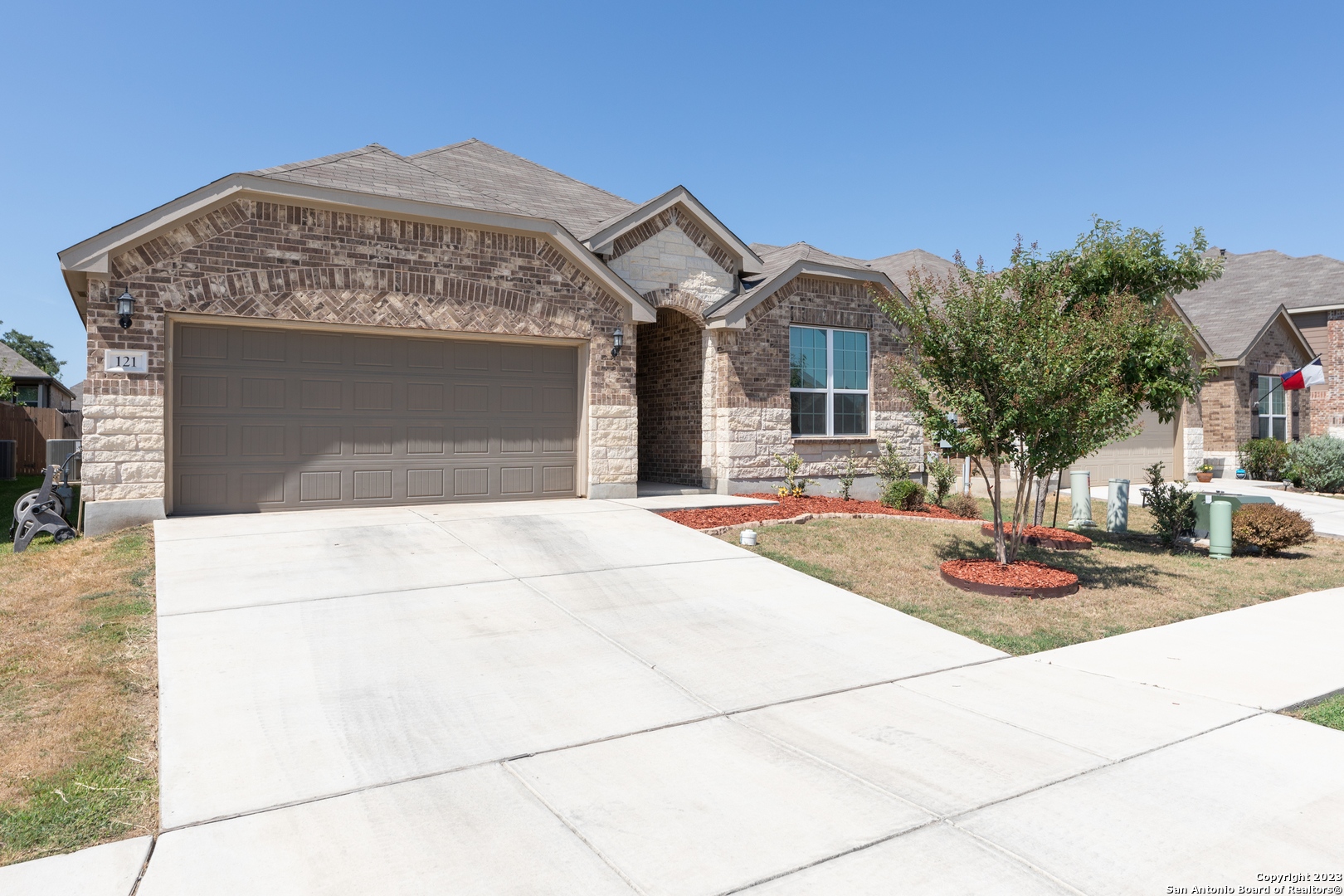 a front view of a house with garden