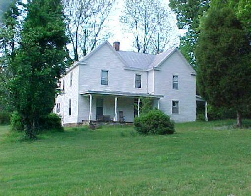 1980 Mosco Road Axton, VA 24054 - Photo 1 of 5 a front view of a house with a yard