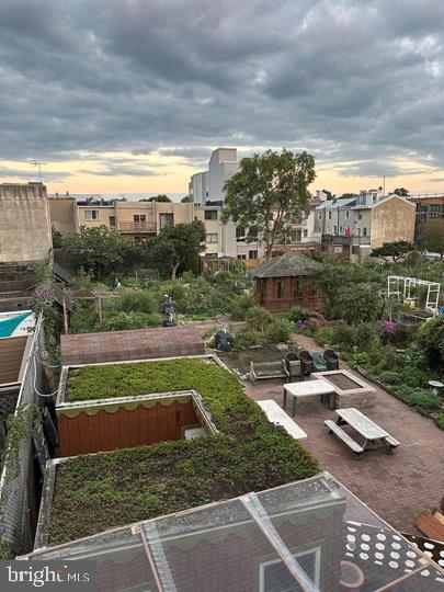 326 Queen Street, Unit 6 Philadelphia, PA 19147 - Photo 12 of 12 a view of a swimming pool with a bench in front of the city