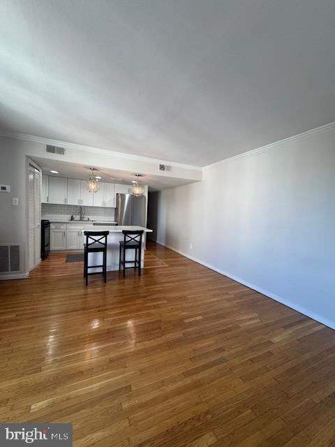 326 Queen Street, Unit 6 Philadelphia, PA 19147 - Photo 3 of 12 a room with wooden floor and dining room view