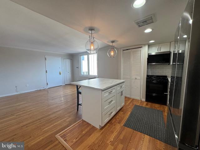 326 Queen Street, Unit 6 Philadelphia, PA 19147 - Photo 5 of 12 a kitchen with a sink and a stove top oven