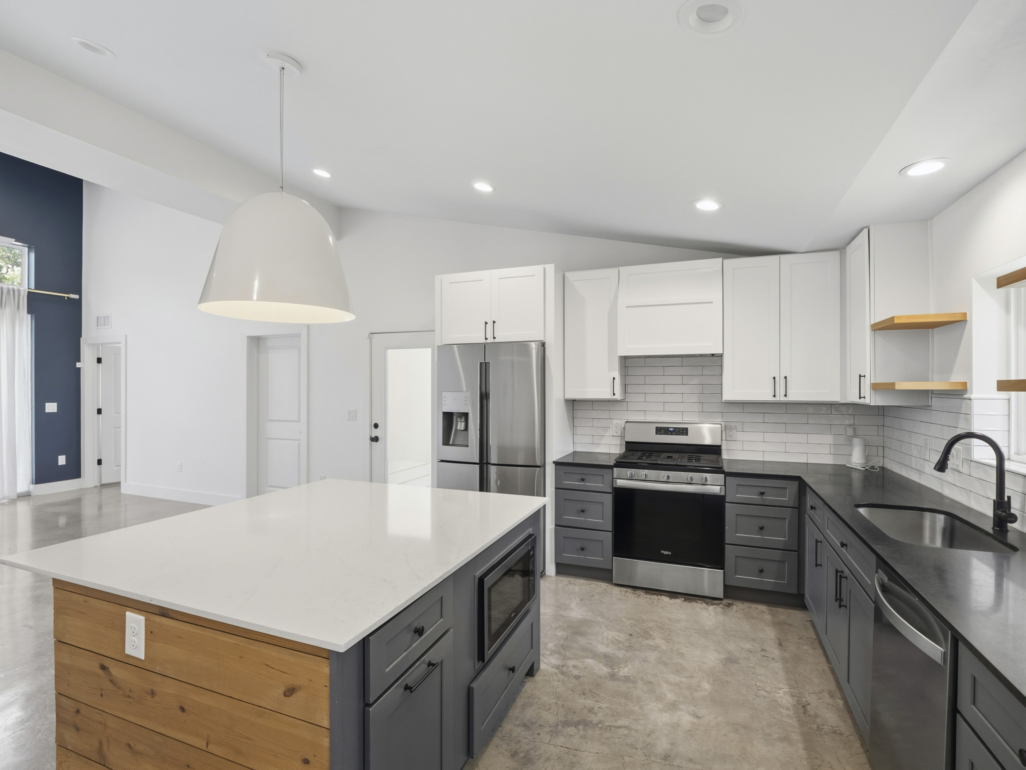 5005 Lott Avenue, Unit 2 Austin, TX 78721 - Photo 5 of 25 Culinary aspirations come alive in this kitchen, featuring stainless steel appliances and a spacious island.