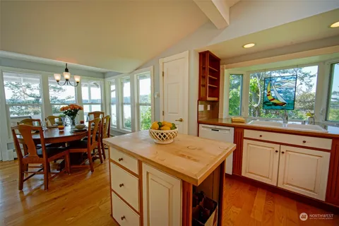 a kitchen with stainless steel appliances granite countertop a stove and a sink