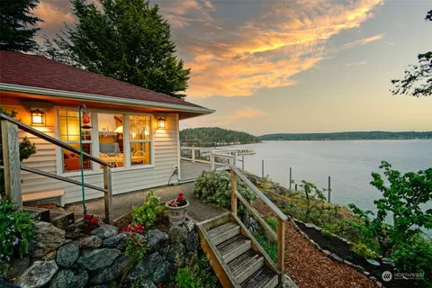 a view of a balcony with two chairs and a table