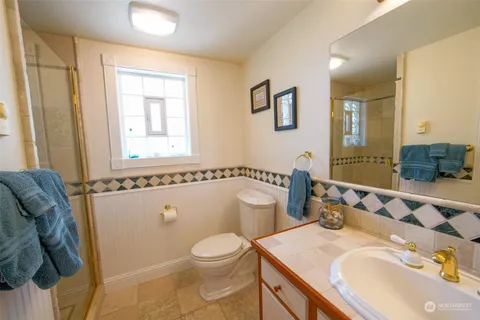 a backyard of a house with lots of plants and trees