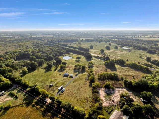 an aerial view of residential building with parking space