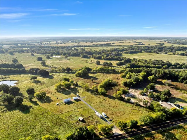an aerial view of residential building and ocean