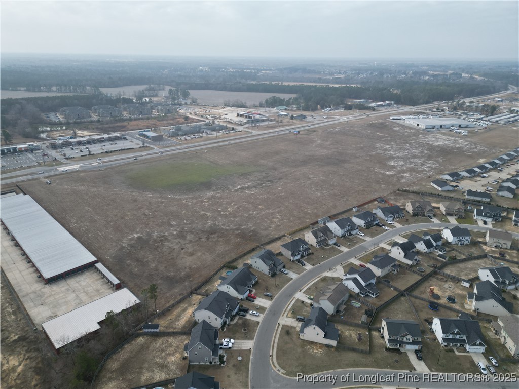 0 Fayetteville Road Raeford, NC 28376 - Photo 8 of 12 an aerial view of residential houses with outdoor space