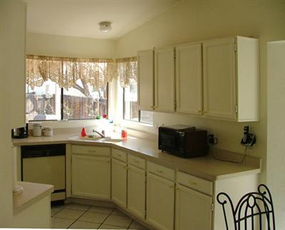 2786 West Firebrook Road Tucson, AZ 85741 - Photo 4 of 8 a kitchen with a sink and cabinets
