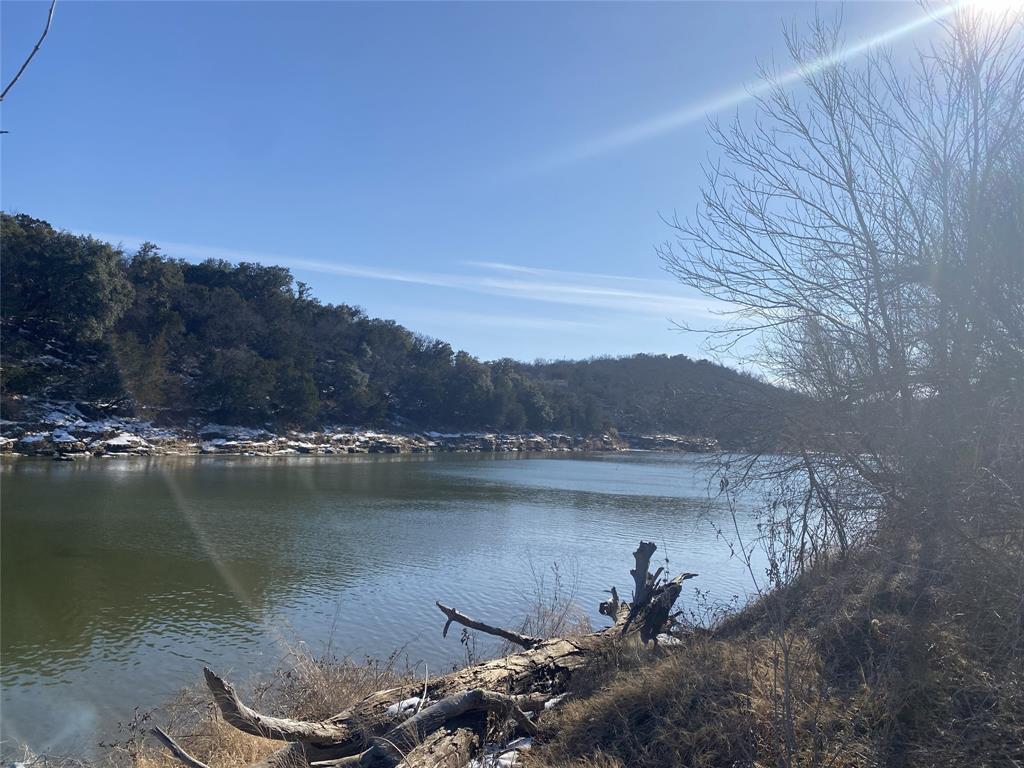 Lot 133 River Shoals Weatherford, TX 76088 - Photo 5 of 20 a view of a lake with a mountain in the background
