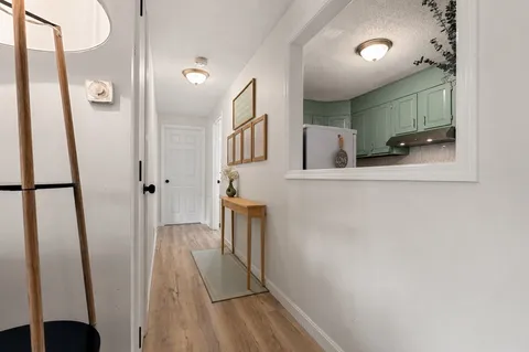 a view of a bathroom from a hallway