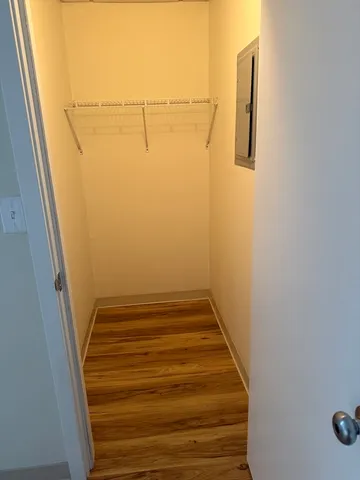 a view of a storage and utility room with washer and dryer