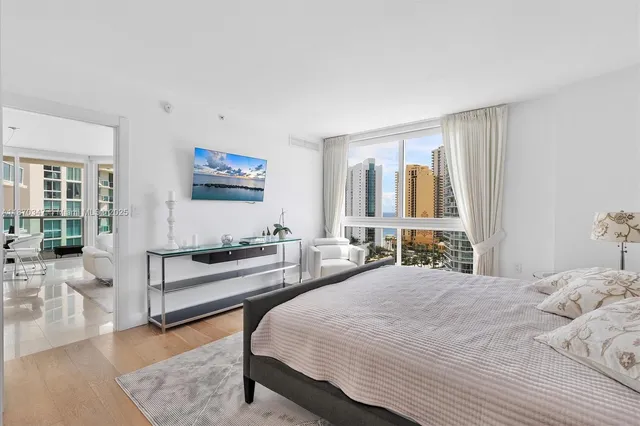 a bedroom with a bed and a couch