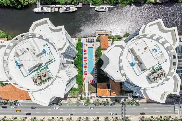 an aerial view of a house with a swimming pool