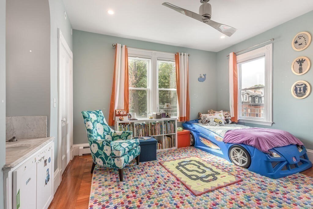 45 M Street Boston, MA 02127 - Photo 17 of 42 a bed room with a bed and a chair