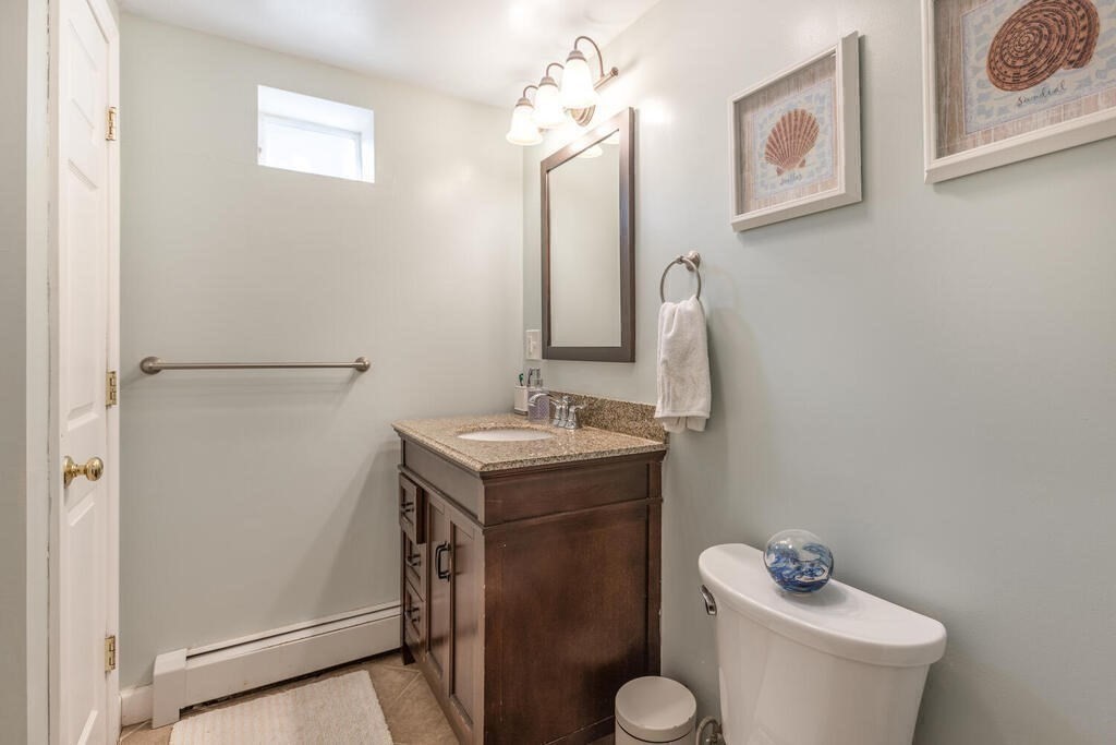 45 M Street Boston, MA 02127 - Photo 30 of 42 a bathroom with a sink a toilet and mirror