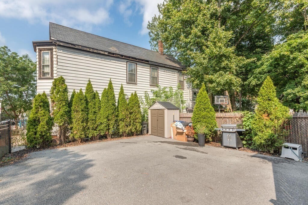 45 M Street Boston, MA 02127 - Photo 31 of 42 front view of a house with a street