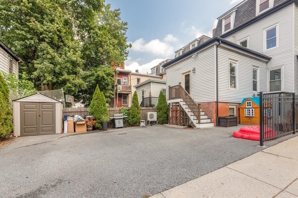 45 M Street Boston, MA 02127 - Photo 32 of 42 a view of a house with large space and a car parked beside it