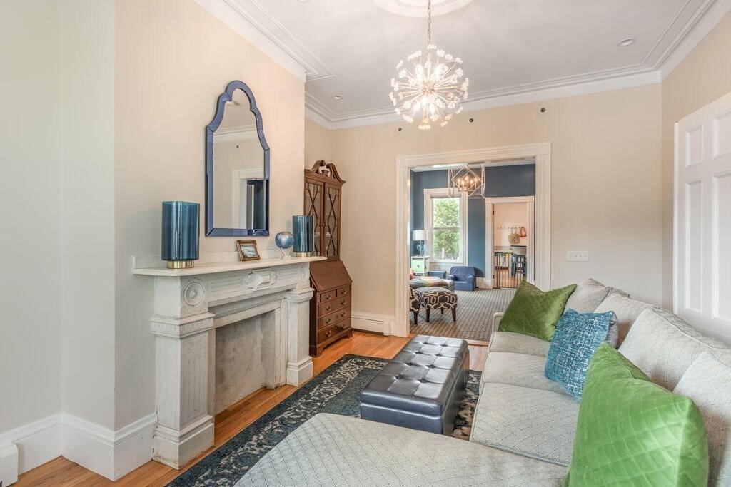 45 M Street Boston, MA 02127 - Photo 8 of 42 a living room with furniture and a chandelier