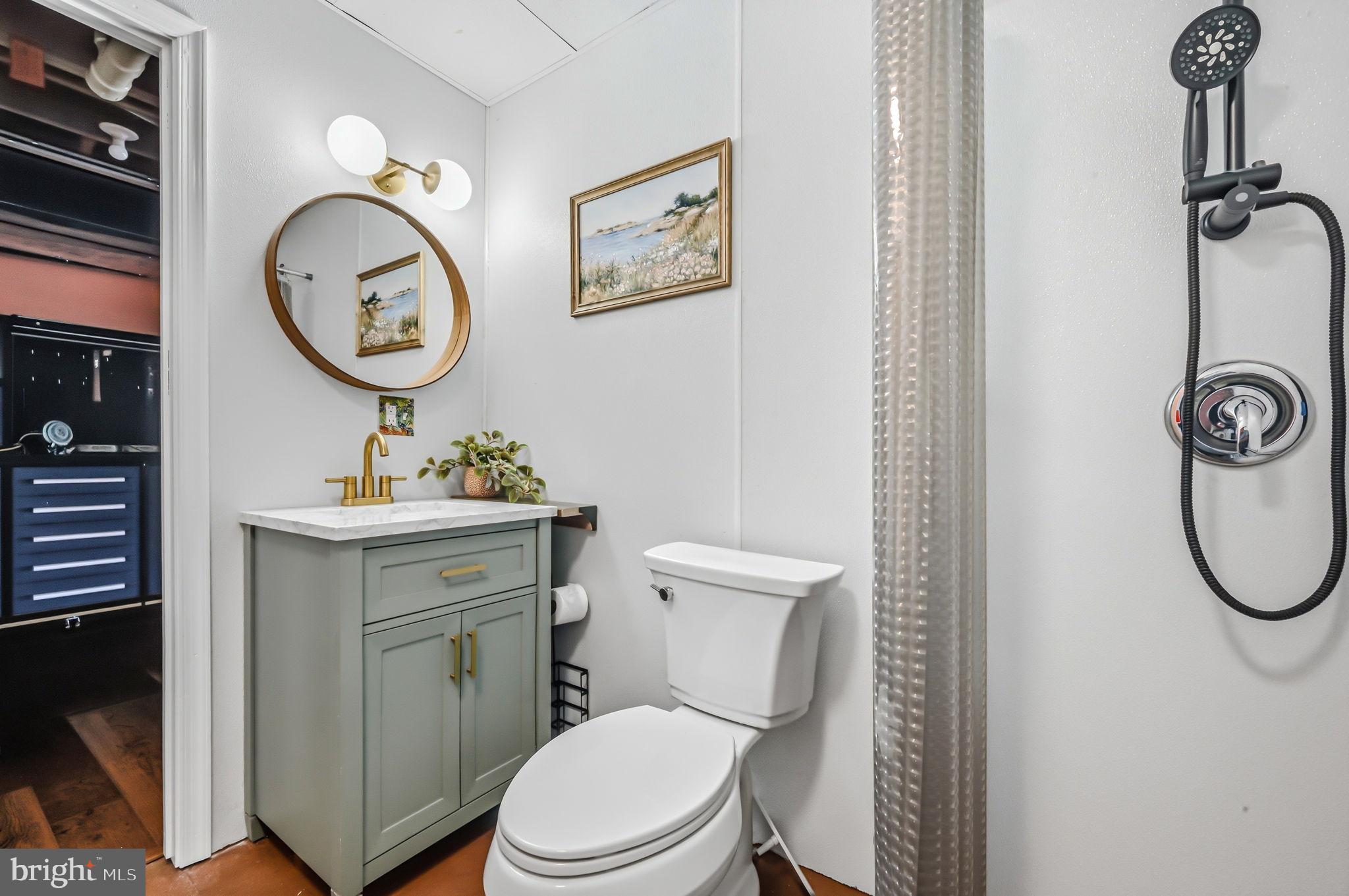 210 Elk View Road North East, MD 21901 - Photo 29 of 64 a bathroom with a toilet sink vanity and mirror
