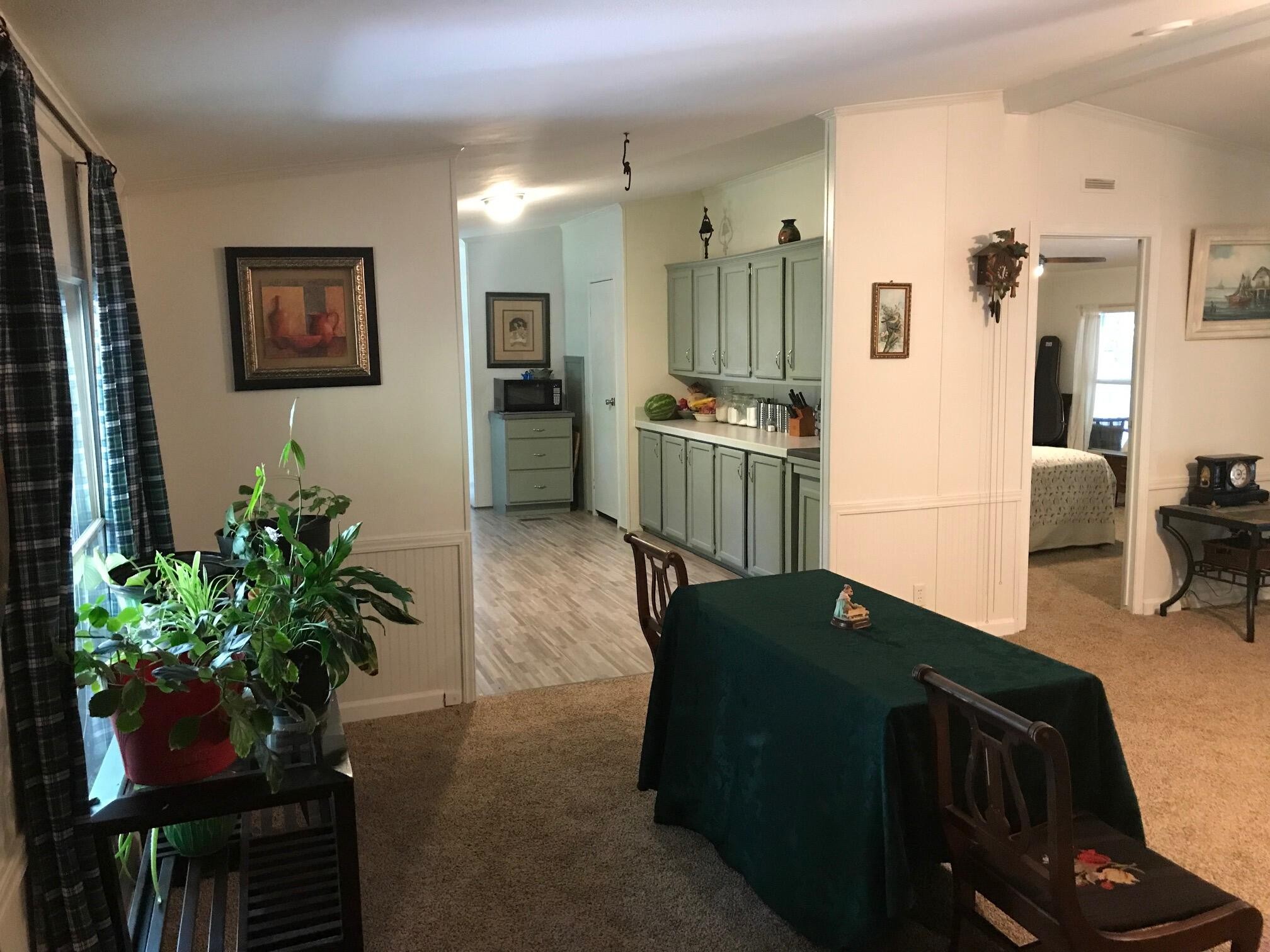 139 Knight Road Dunlap, TN 37327 - Photo 3 of 30 a living room with furniture potted plant and a flat screen tv