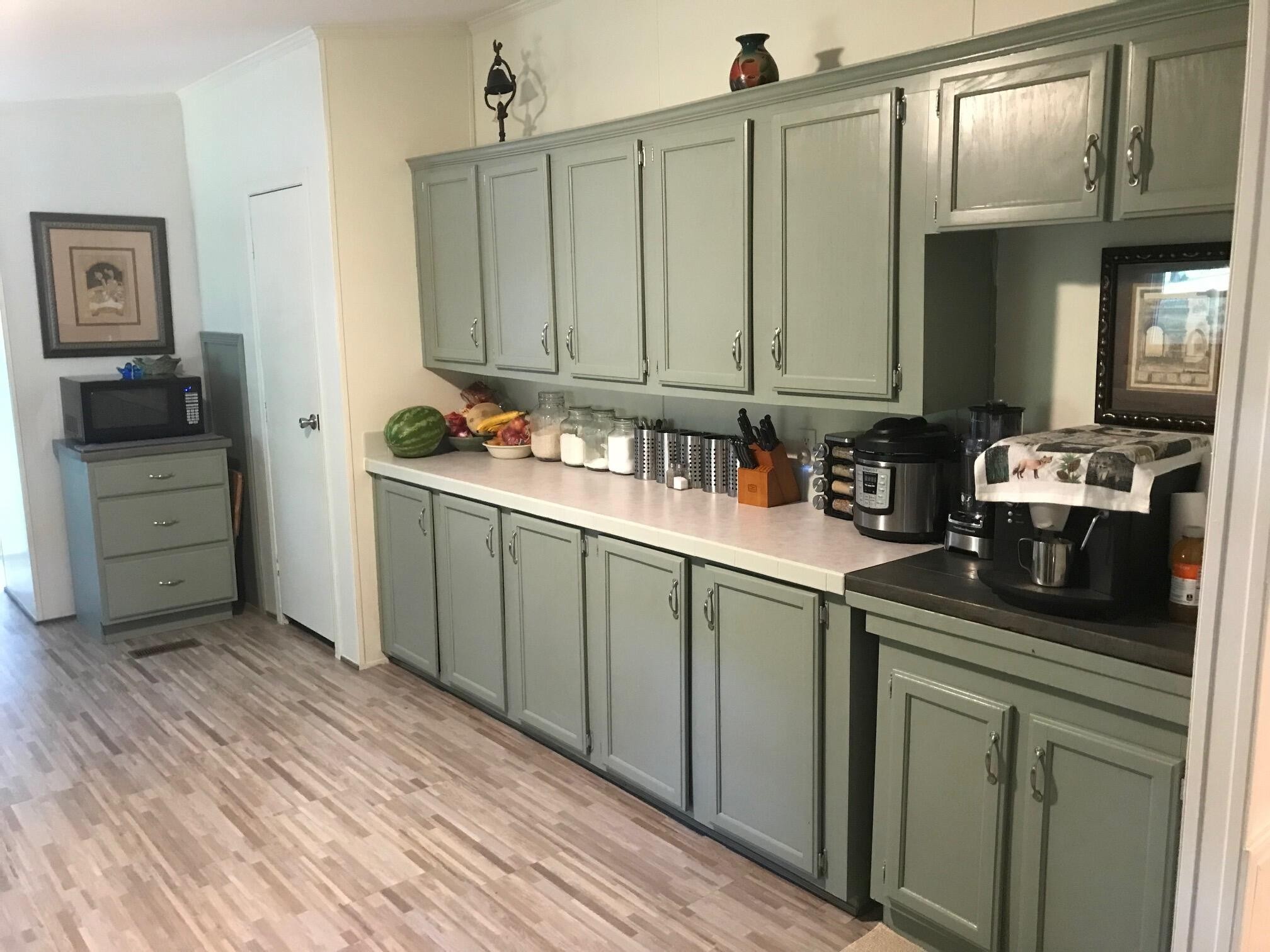 139 Knight Road Dunlap, TN 37327 - Photo 7 of 30 a kitchen with stainless steel appliances a sink cabinets and wooden floor