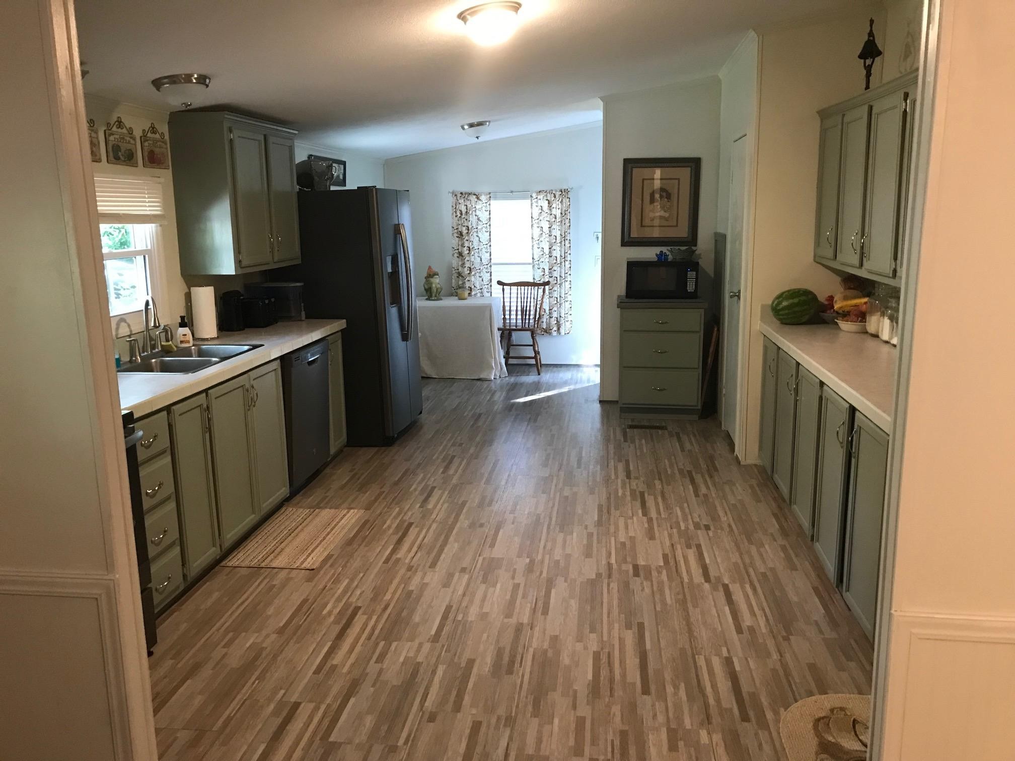 139 Knight Road Dunlap, TN 37327 - Photo 9 of 30 a kitchen with a sink and wooden floor