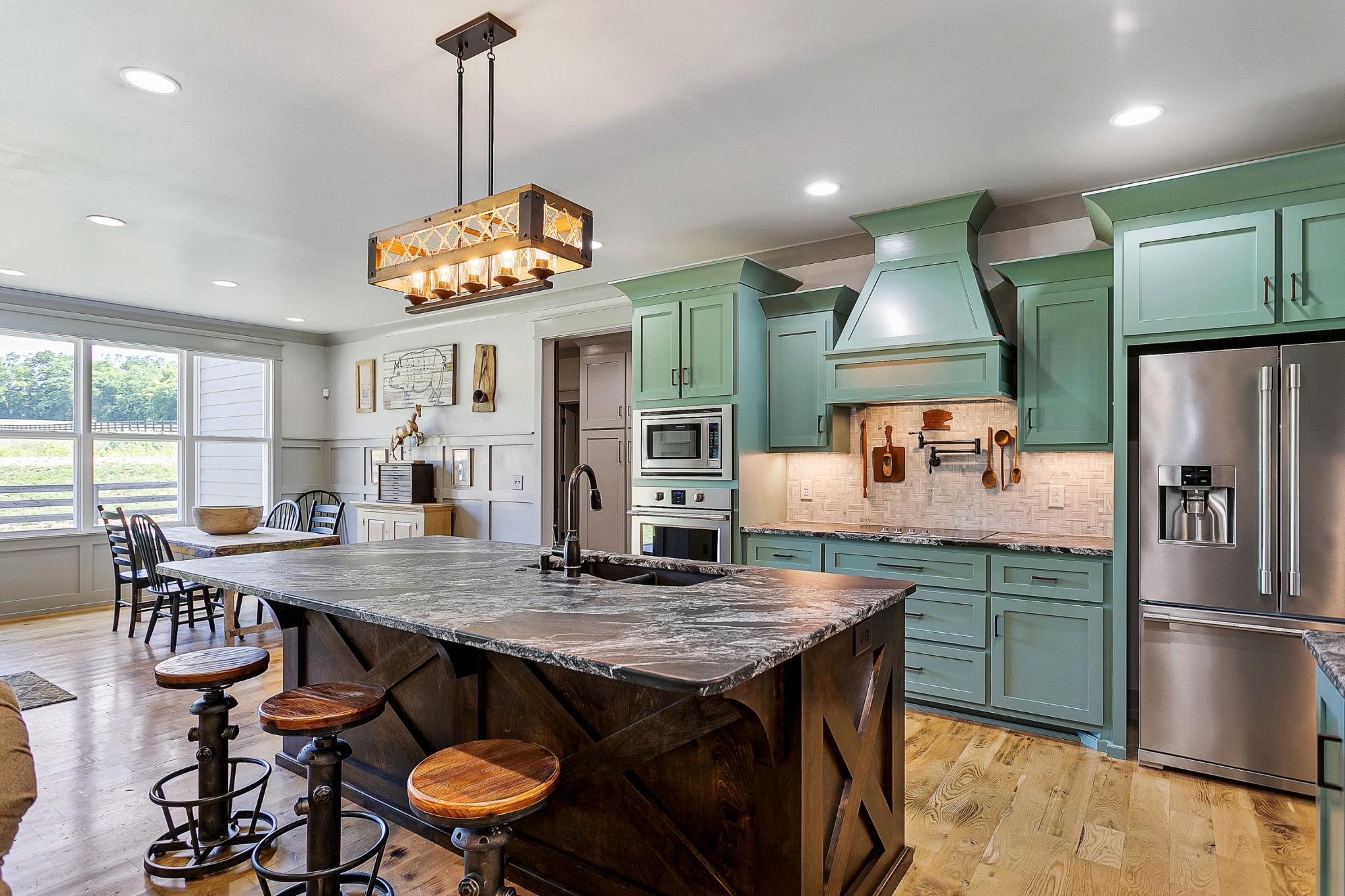790 Baker Road Columbia, TN 38401 - Photo 13 of 69 a kitchen with stainless steel appliances granite countertop a kitchen island a table and chairs