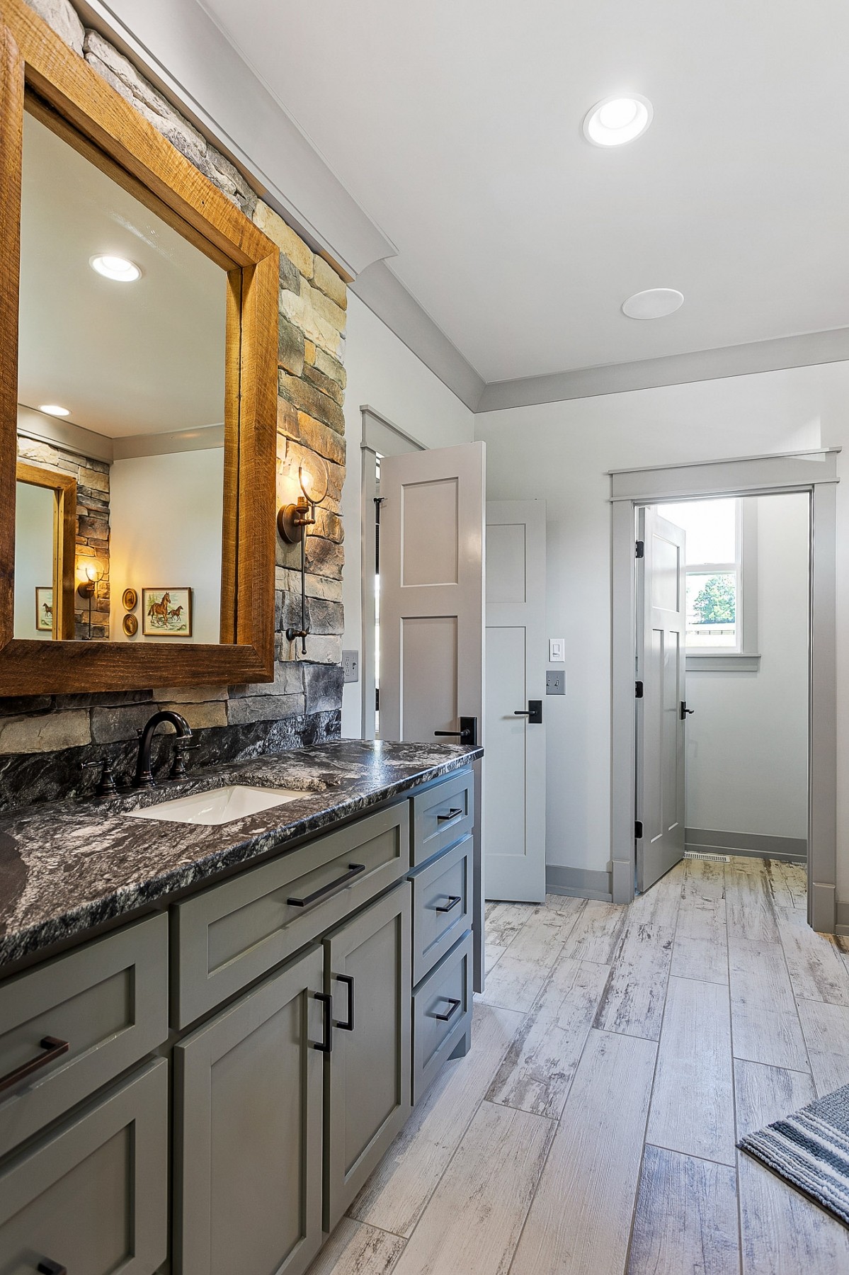 790 Baker Road Columbia, TN 38401 - Photo 29 of 69 a spacious bathroom with a granite countertop sink and a mirror