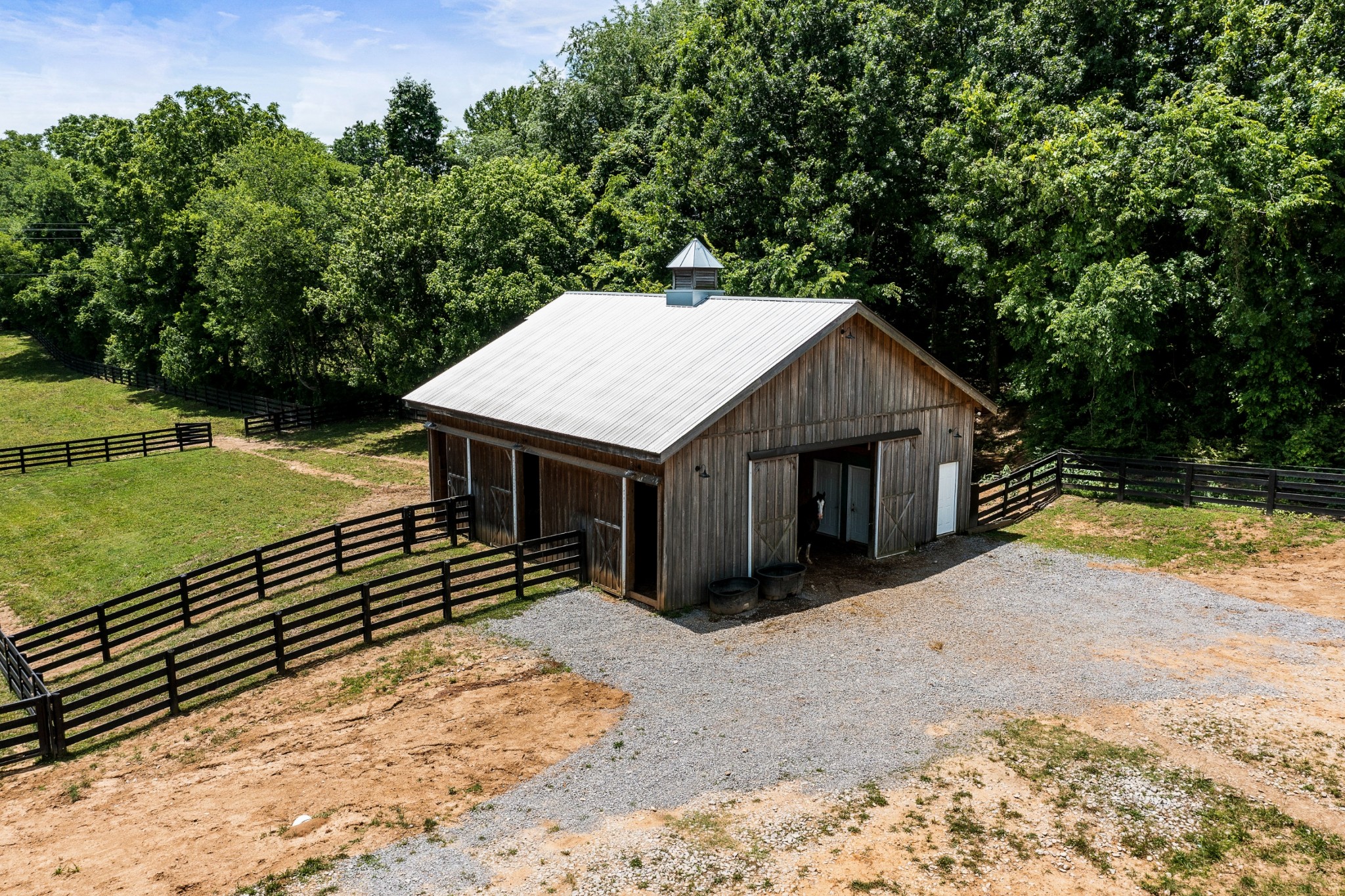790 Baker Road Columbia, TN 38401 - Photo 62 of 69 a house with a wooden fence next to a yard