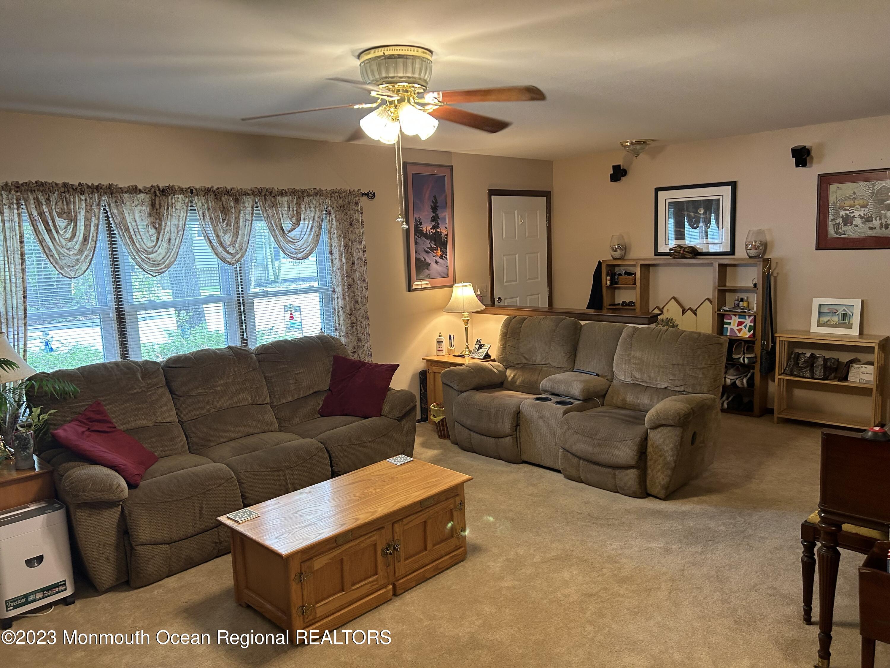 1635 Burrsville Road Brick, NJ 08724 - Photo 3 of 15 a living room with furniture ceiling fan and a window