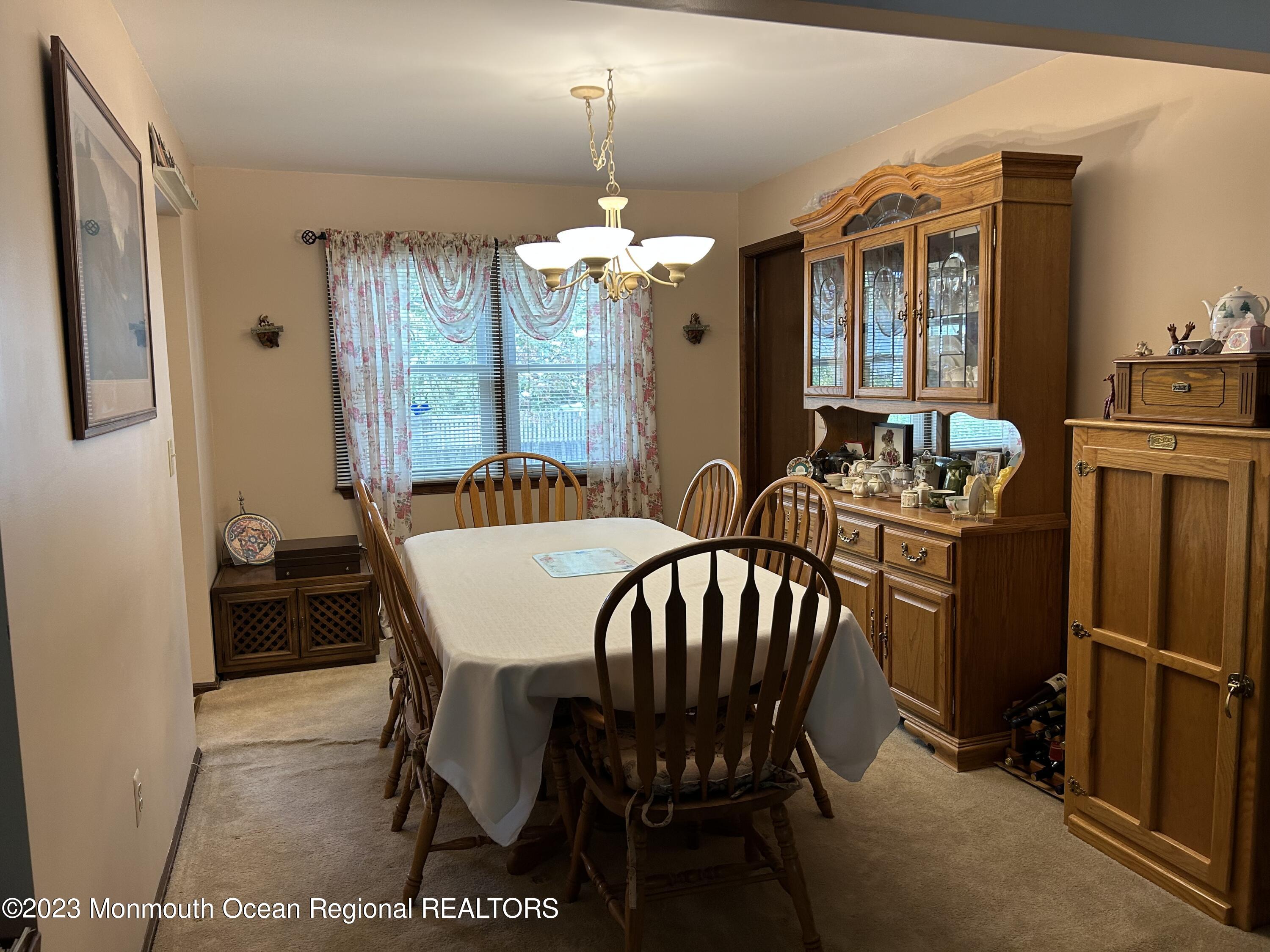 1635 Burrsville Road Brick, NJ 08724 - Photo 5 of 15 a view of a dining room with furniture window and outside view