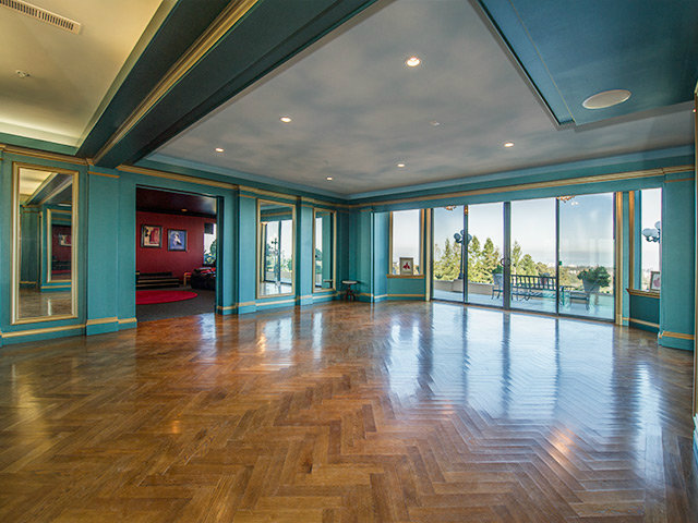 150 New Place Road Hillsborough, CA 94010 - Photo 11 of 25 a view of empty room with wooden floor and floor to ceiling window