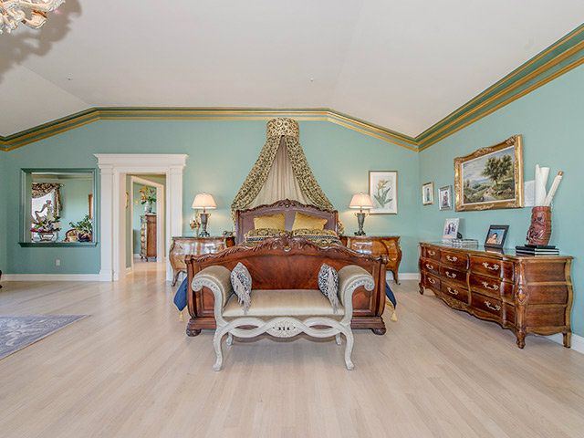 150 New Place Road Hillsborough, CA 94010 - Photo 12 of 25 a living room with furniture a couch and paintings on the wall