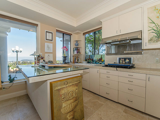 150 New Place Road Hillsborough, CA 94010 - Photo 14 of 25 a kitchen with cabinets appliances a sink and a window