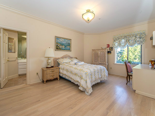 150 New Place Road Hillsborough, CA 94010 - Photo 17 of 25 a bedroom with a bed and wooden floor